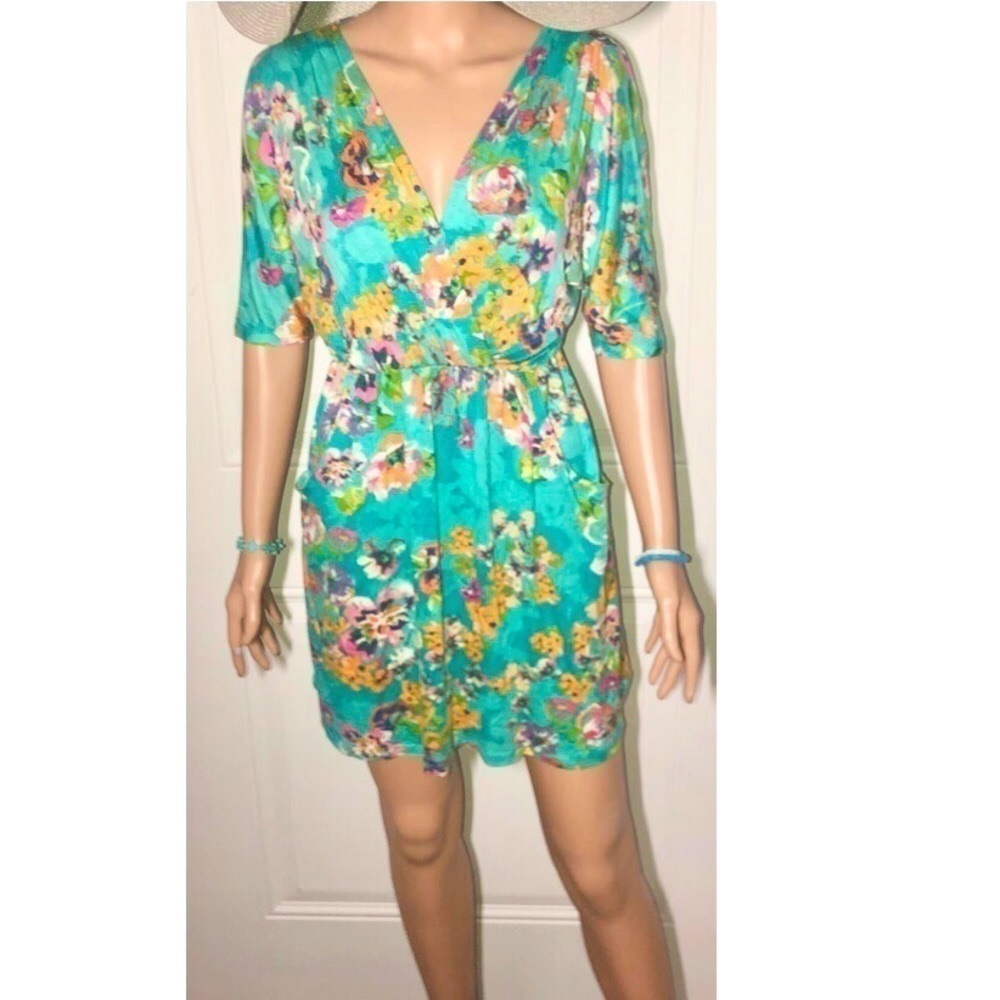 Everly Mini wrap dress Turquoise with floral design pockets Small